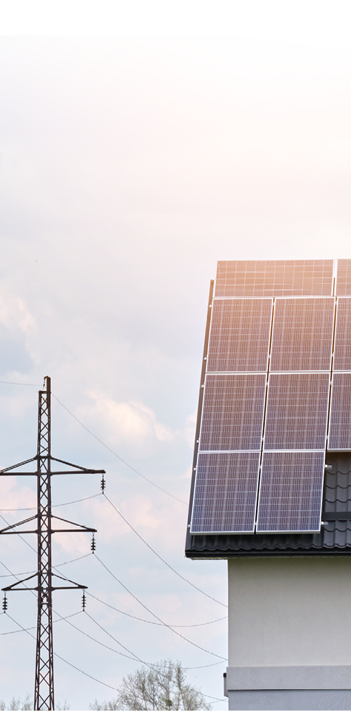 Residential house with rooftop covered with solar photovoltaic panels for producing of clean ecological electrical energy in suburban rural area. Concept of autonomous home.