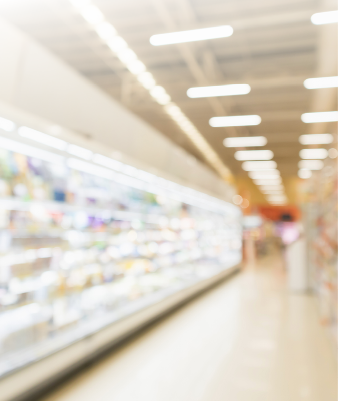 Abstract blur supermarket discount store aisle and product shelves interior defocused background