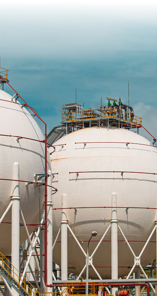 White spherical propane tanks containing fuel gas pipeline.