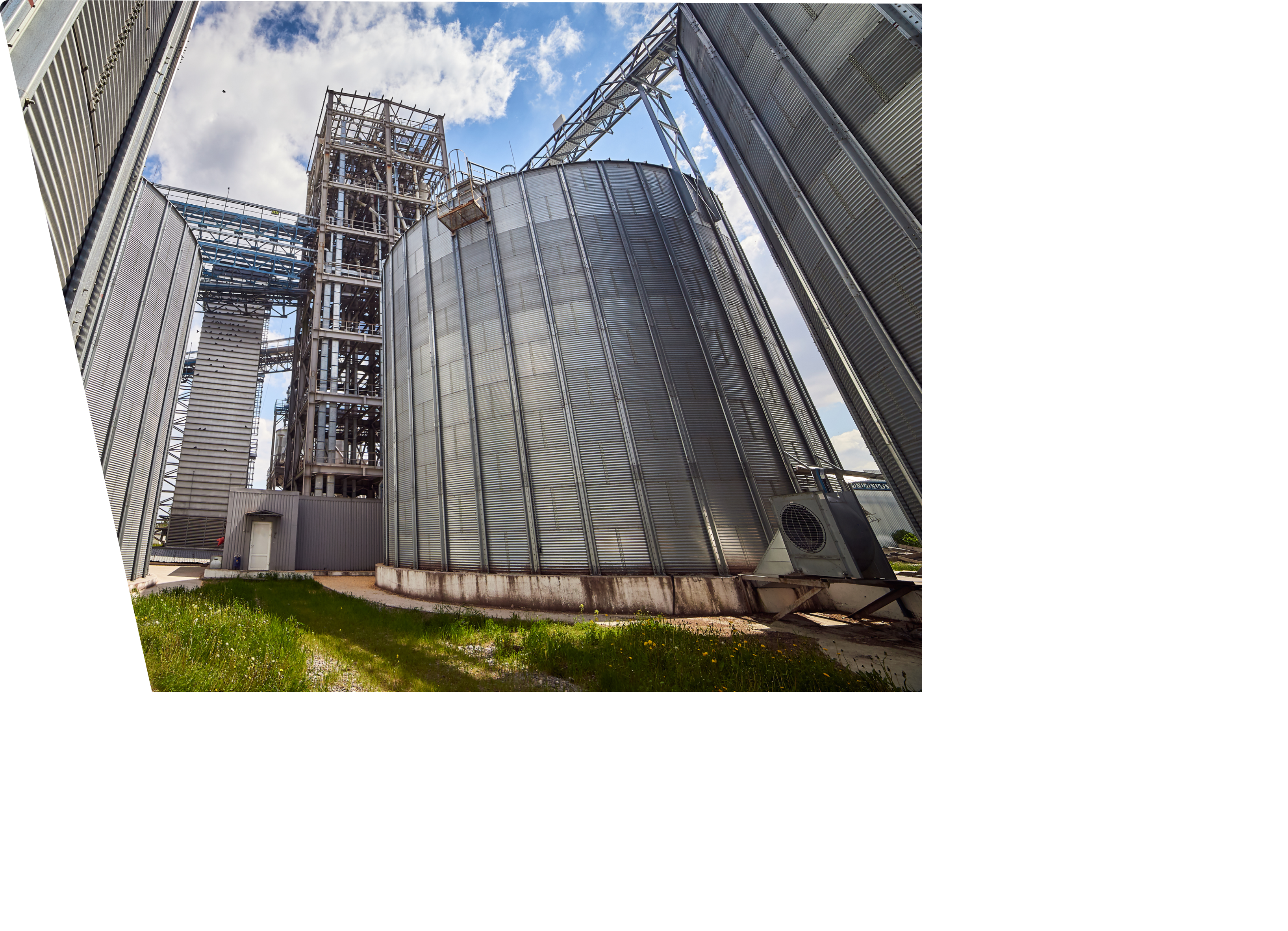 Metal elevator (grain silo) in agriculture zone. Grain Warehouse or depository is an important part of harvesting. Сorn, wheat and other crops are stored in it