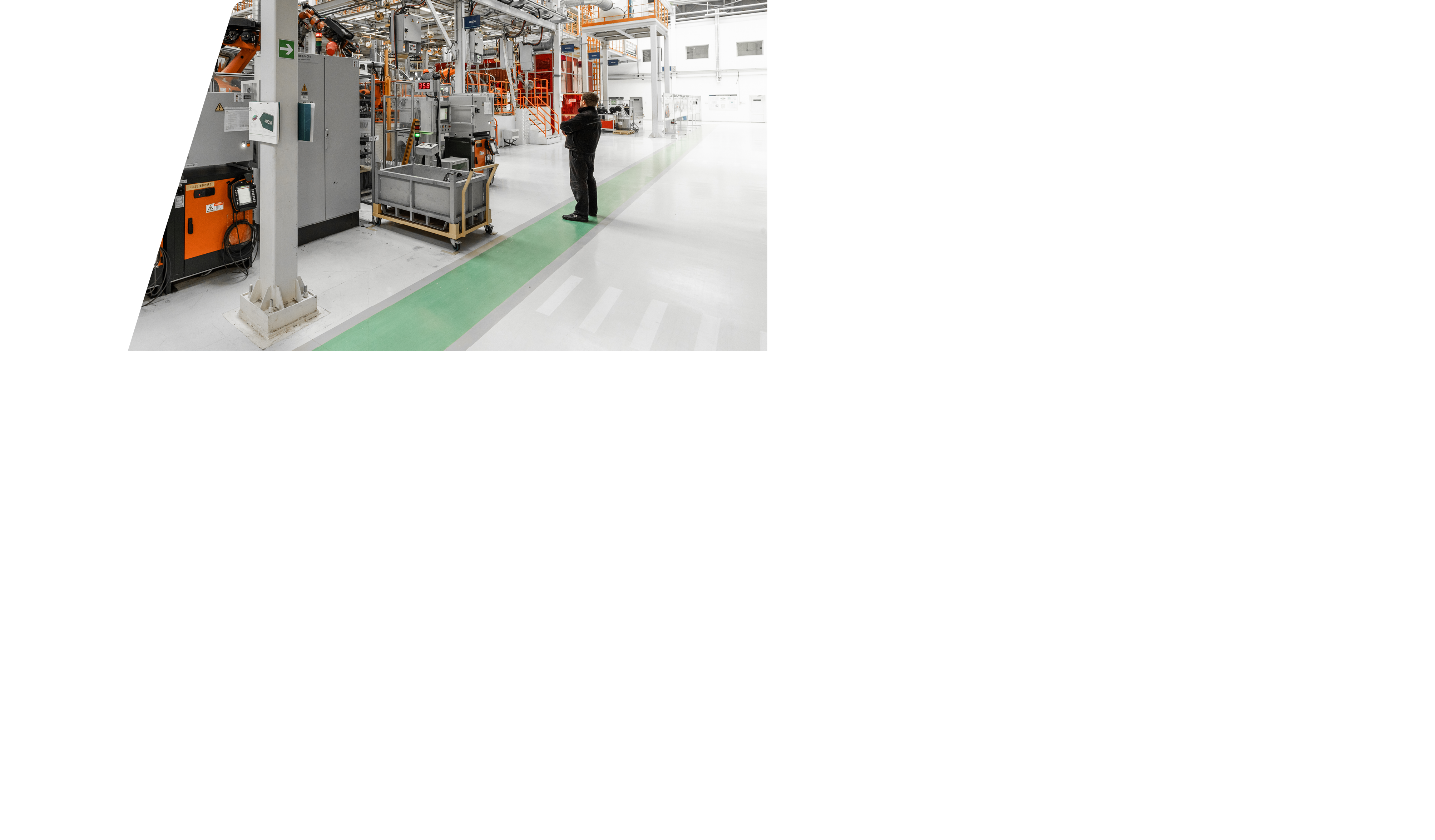 Photo of automobile production line. Welding car body. Modern car assembly plant. Auto industry. Interior of a high-tech factory, modern production.