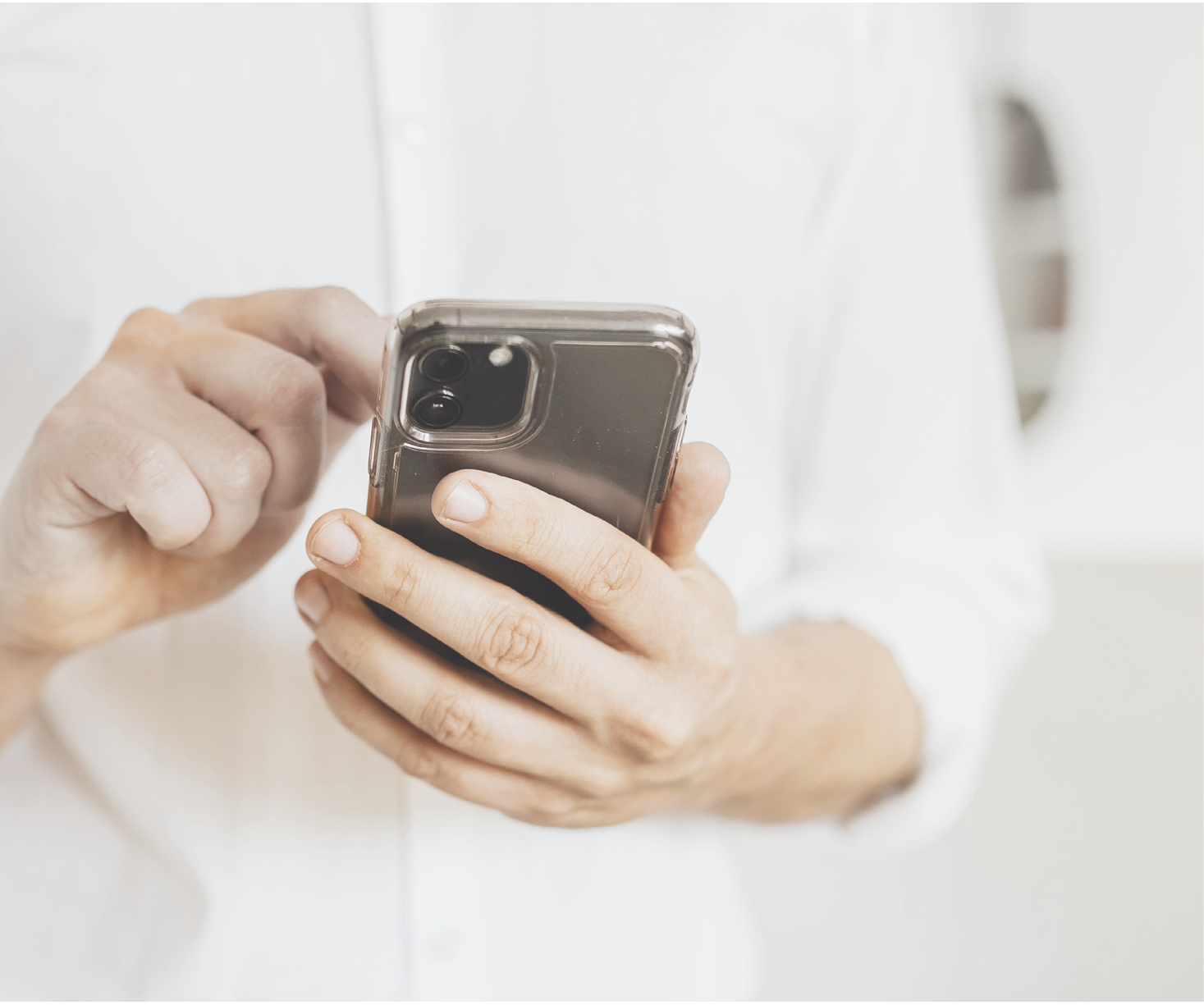 Businessman checking his social media account and messages on a phone