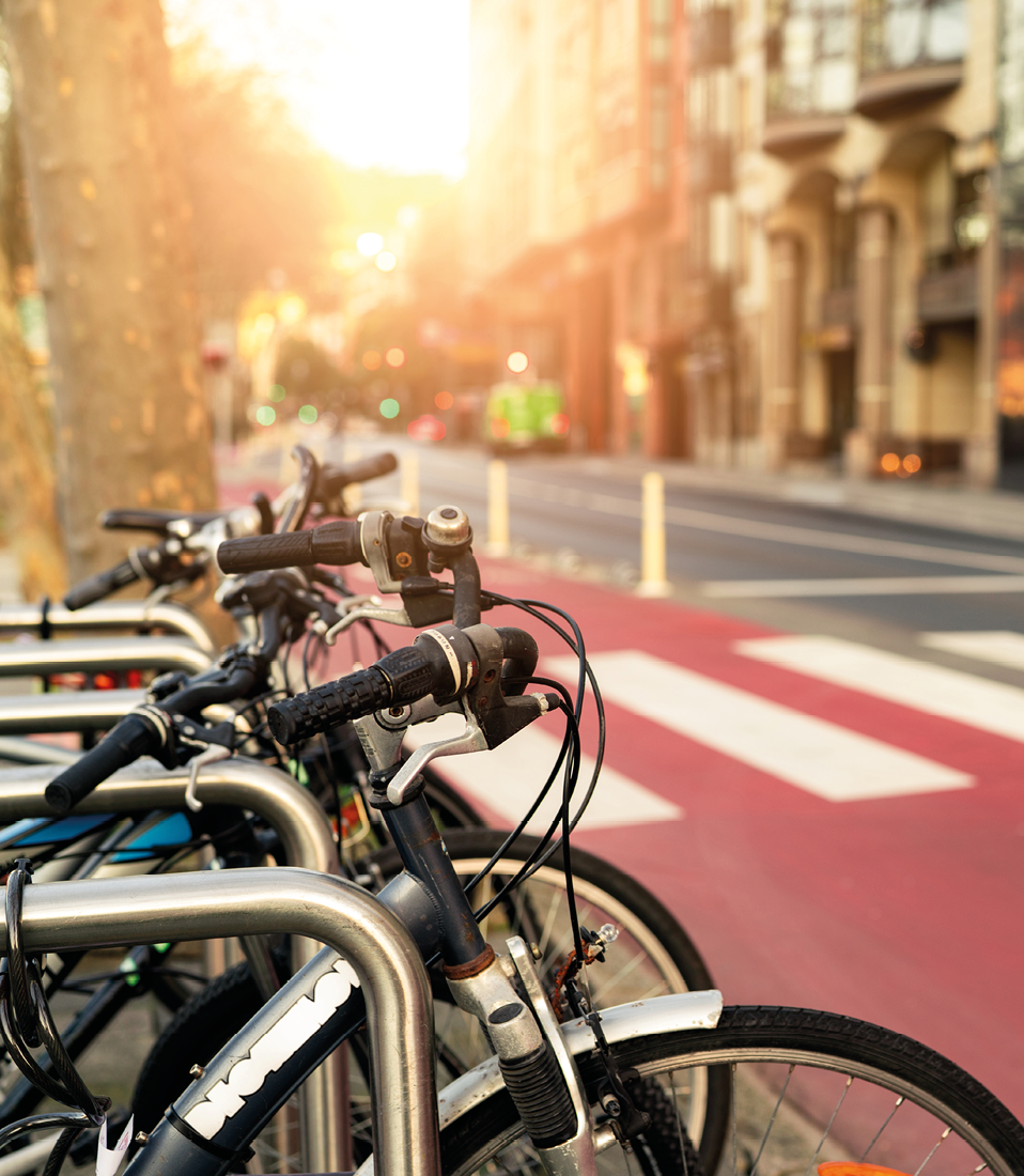 Bicycle at bike station for rent to travel or transport in the city. Sustainable travel. Bicycle sharing system. Bicycle for city tour at bike parking station. Eco-friendly transport. Urban transport.