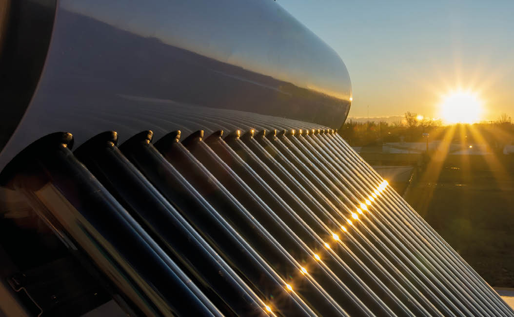 solar hot water tank at sunset