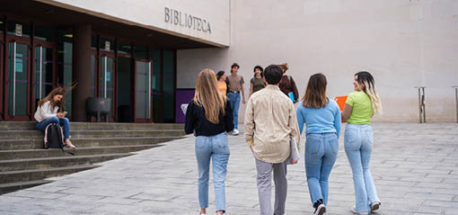 Group of students going in and out of the study library to prepare for university exams. Concept: Studies, education, training